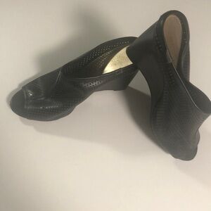 Black wedge heels. Christian Soriano.